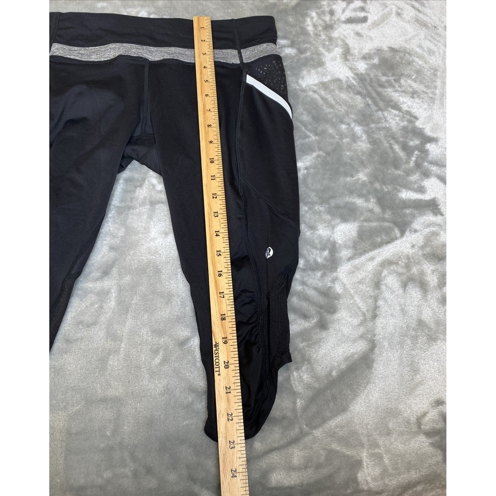 Lululemon Run a Marathon Crop Pant Size 10 Black Side Pockets Reflective Stripes - Picture 7 of 8